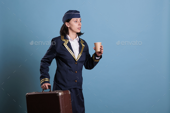 Flight attendant in professional aviation uniform running late