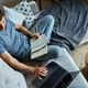 Man sitting on couch and using laptop - PhotoDune Item for Sale