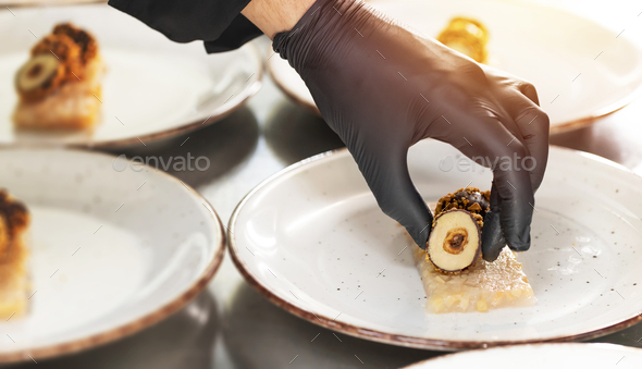 Chef put some food elements - Stock Photo - Images