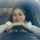Excited young woman sitting in her car, prepared for driving. - PhotoDune Item for Sale