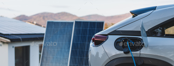 Charging an electric car from home photovoltaics power station ,sustainable and economic - Stock Photo - Images