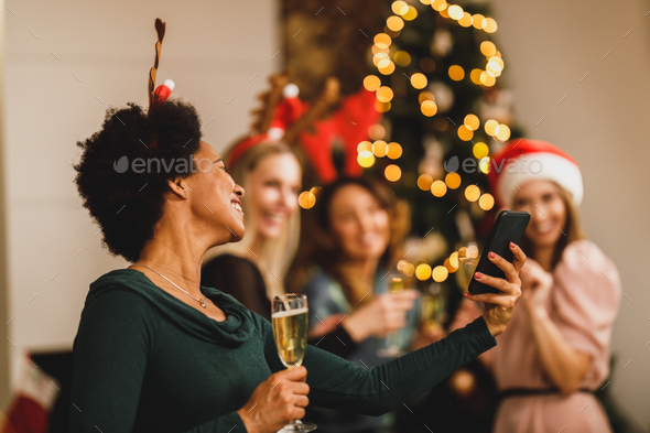 Multiracial Group Of Female Friends Making Video Call During Christmas Holidays - Stock Photo - Images