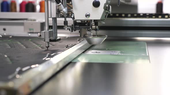 Robotics Works in Tailoring Production Line. Robot Sewing Machine. an Automated Machine Embroidery alt