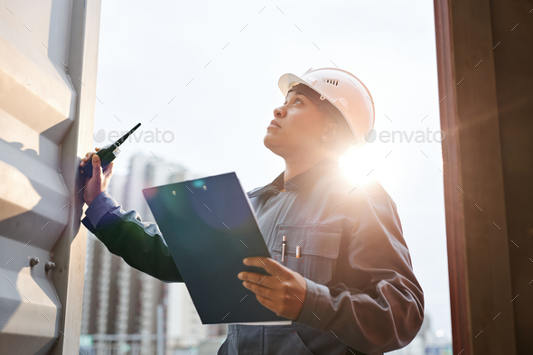 Dock worker in sunlight