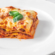 Portion of lasagne on white plate - PhotoDune Item for Sale