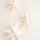 Merry Christmas.Christmas stars handmade light beige background.Monochrome,Christmas background - PhotoDune Item for Sale