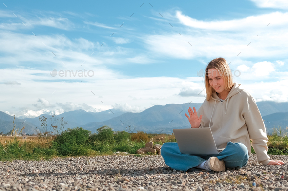 Remote work.Girl freelancer works remotely on the sea shore. workation, remote work,WFVH,Van Life vi - Stock Photo - Images