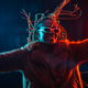 Black ethnic woman with braids with blue and red led lights, moving her hair while dancing - PhotoDune Item for Sale