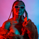 Attractive black ethnic woman with braids with red blue led lights, trap dancer wearing sunglasses - PhotoDune Item for Sale