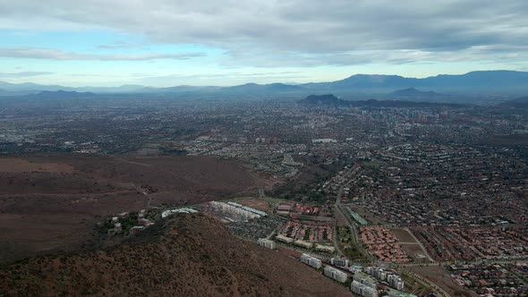 Aerial view truck right on a cloudy day in the city of Santiago, Chile. Commune of Las Condes alt