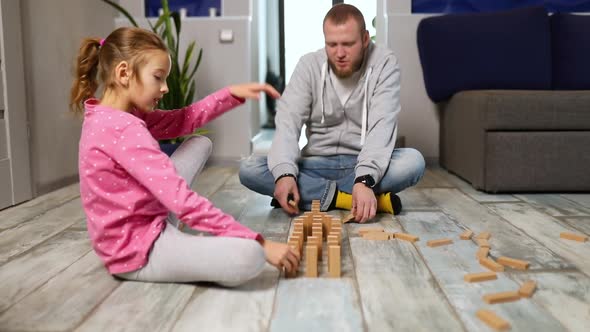 Father and Happy Daughter Play Wooden Blocks Friendship
