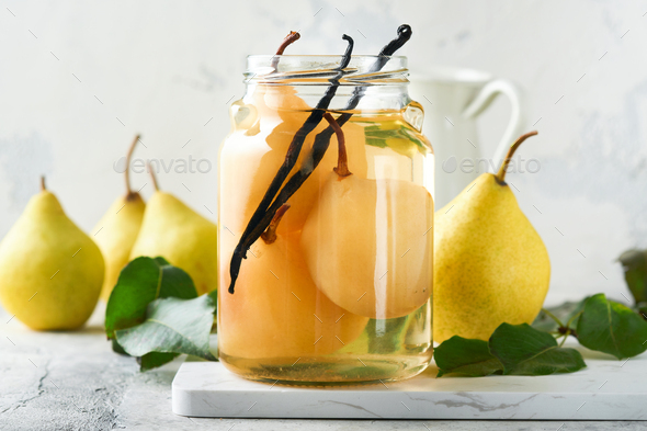 Canned pear compote with vanillin. Pear compote. Homemade delicious canned pear compote in glass jar