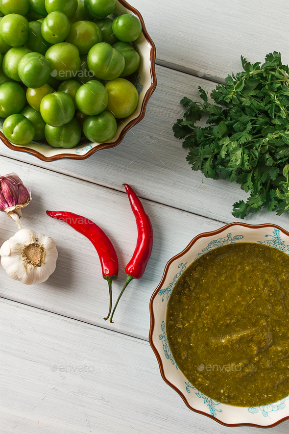 Tkemali sauce, traditional cuisine, green cherry plum, on a