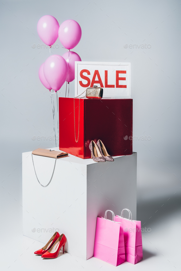 bundle of balloons, pink shopping bags and sale sign, summer sale concept