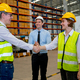 Professional manager clap hands for the team with warehouse worker man shake hands with co-worker - PhotoDune Item for Sale