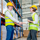 Professional warehouse worker man and woman shake hands together before work with the project - PhotoDune Item for Sale