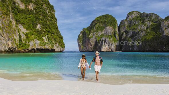 Maya Bay beach Koh Phi Phi Thailand in the morning with turqouse colored ocean - Stock Photo - Images