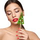 Beauty model girl eating Christmas tree shape lollipop - PhotoDune Item for Sale