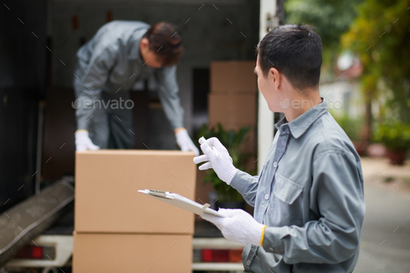 Loading Packages with Fragile Items - Stock Photo - Images