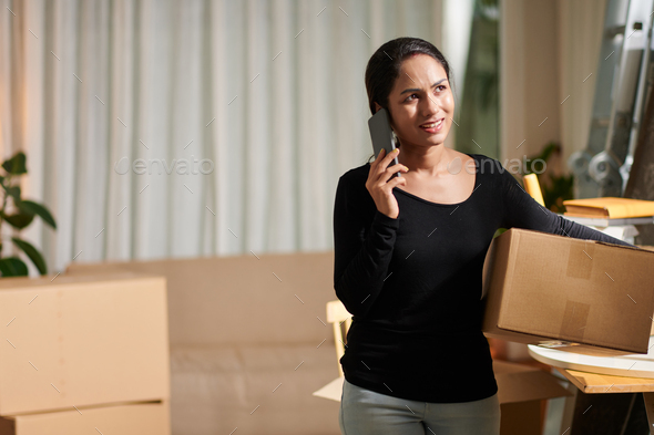 Woman Calling to Manager of Moving Company