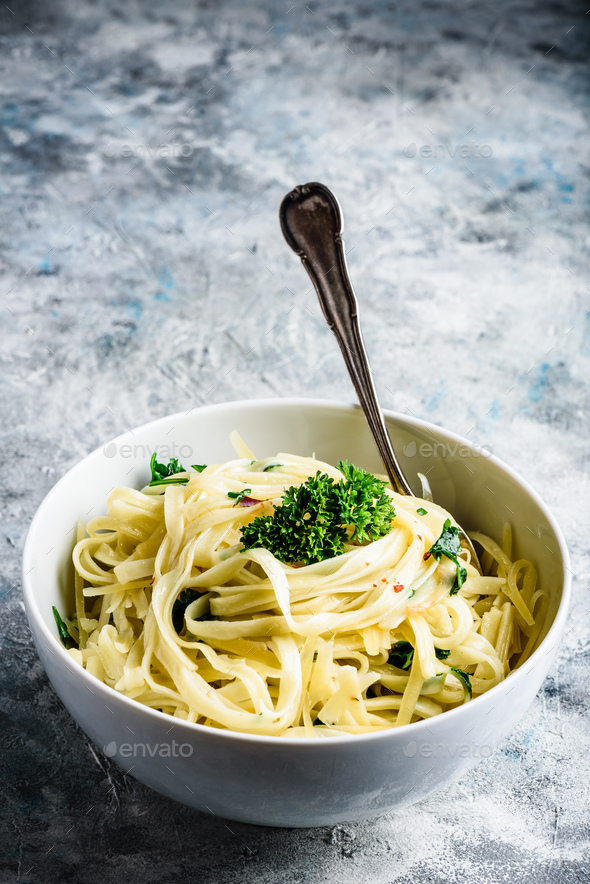 Easy pasta with olive oil and garlic Stock Photo by Seva_blsv PhotoDune