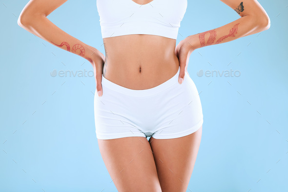 Shot of an unrecognizable woman posing in her underwear against a