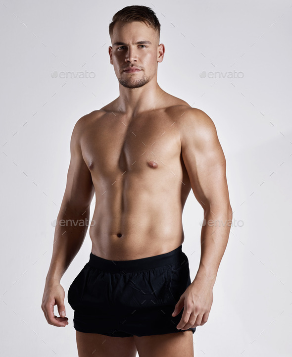 Want to know what fit looks like. Shot of a muscular young man posing