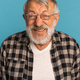 Portrait retired old man with white hair and beard laughter excited over blue color background - PhotoDune Item for Sale