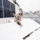 Woman cleans solar panels from snow - PhotoDune Item for Sale