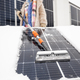 Woman cleans solar panels from snow - PhotoDune Item for Sale