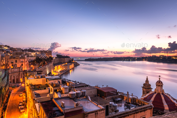 Sunrise at the Grand Harbour of Malta with the ancient walls of Valletta - Stock Photo - Images