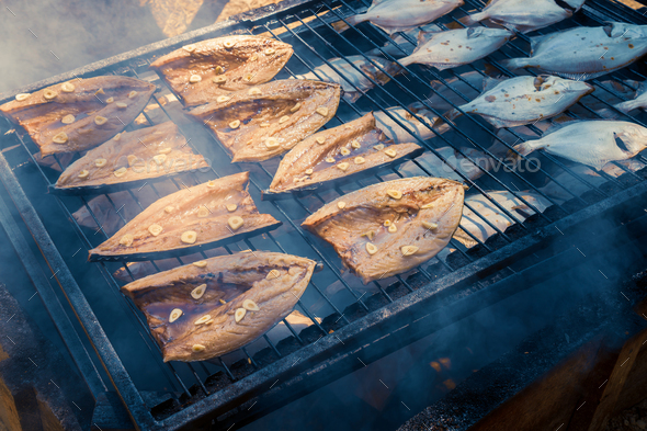 Fish Smoking Process Smoked Mackerel And Flounder Close Up Smoking