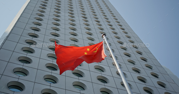 Central, Hong Kong 22 October 2019: Flag of China over business tower in Hong Kong - Stock Photo - Images