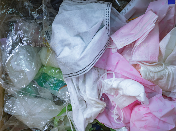 Used sanitary napkins, surgical face mask, and plastic in the trash. Infectious waste management