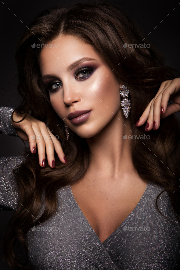 Beautiful woman with professional make up and curly hair - Stock Photo - Images
