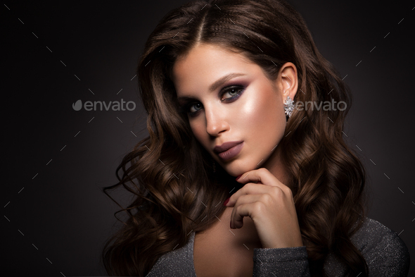 Beautiful woman with professional make up and curly hair - Stock Photo - Images