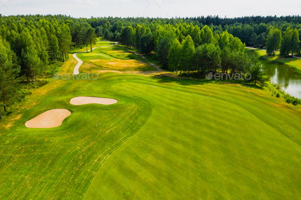 Top view of the golf course located in a wooded area Stock Photo by ...