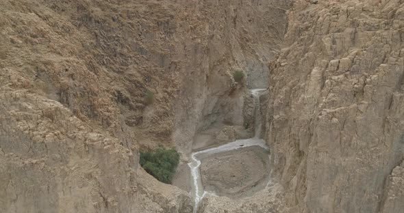 Aerial view of a waterfall in a desert, Israel. alt