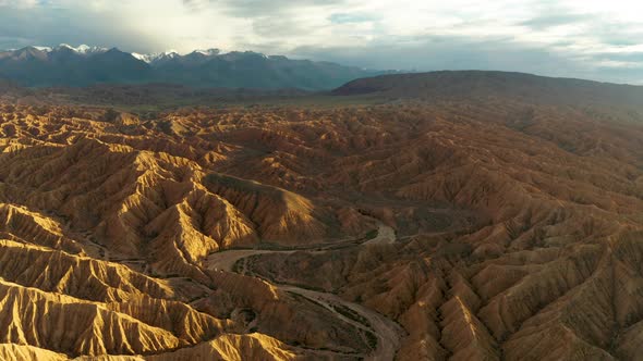 Aerial View of Desert Landscape in Kyrgyzstan at Sunset alt