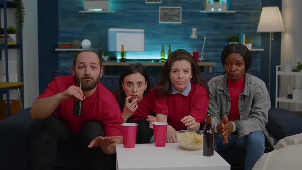 Upset Group of Multiethnic Sport Fans Frustreated After Football Team Losing Match alt