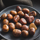 Peeled chestnuts. Sweet roasted chestnuts on  plate. - PhotoDune Item for Sale