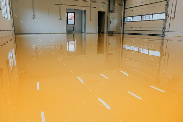 New epoxy floor in warehouse factory. Construction series