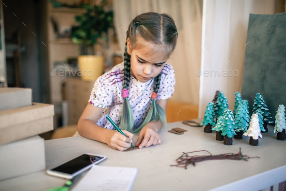 Girl preparing DIY gifts for your parents and family for Christmas