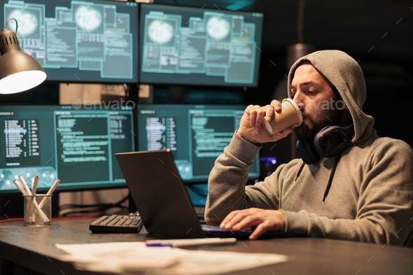 Cyber scammer hacking system to destroy information - Stock Photo - Images