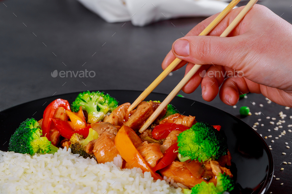 Japanese rice bowl of pieces of chicken fillet with teriyaki sauce