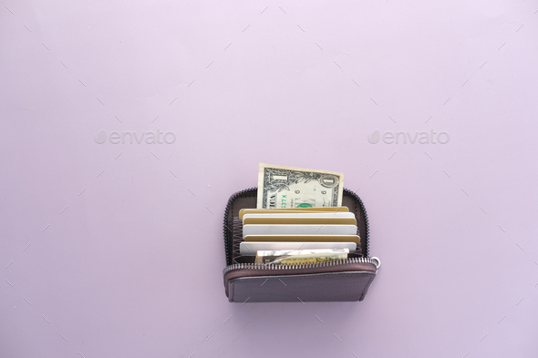 bank cards and cash in a wallet on color background  - Stock Photo - Images