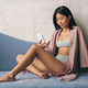 Banner of korean woman talking with friends using online video chat app, sitting on couch at home - PhotoDune Item for Sale