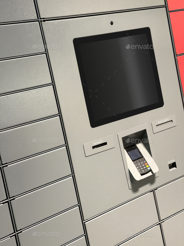Grey and red automated parcel post terminal - Stock Photo - Images