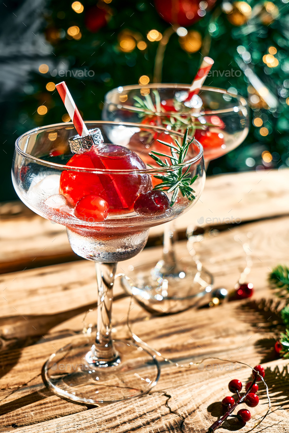 Christmas drink mimosa, punch or cranberry margarita cocktail serving