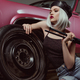 stylish blonde girl in beret leaning at car wheel and looking away while repairing car - PhotoDune Item for Sale